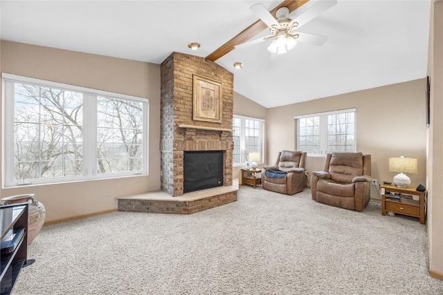 living area featuring vaulted ceiling with beams, carpet floors, a fireplace, a ceiling fan, and baseboards