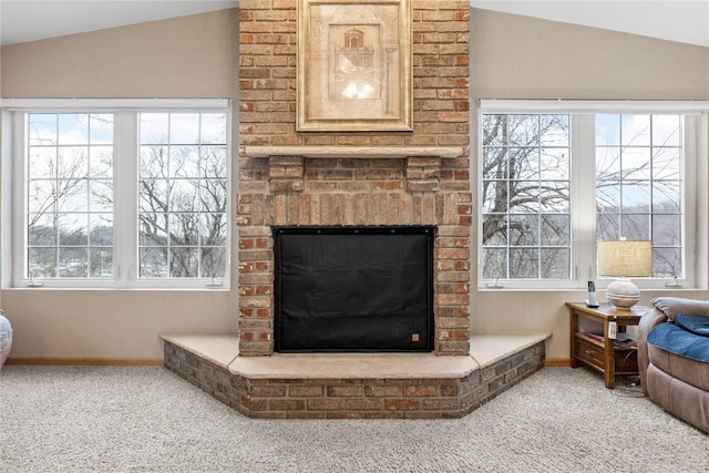 details featuring carpet, a brick fireplace, and baseboards