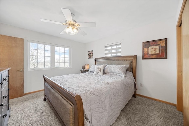 bedroom with baseboards, a ceiling fan, and light colored carpet