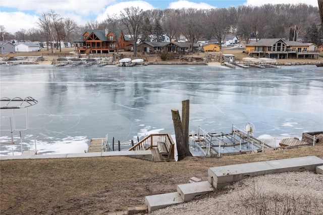 property view of water with a residential view and a boat dock