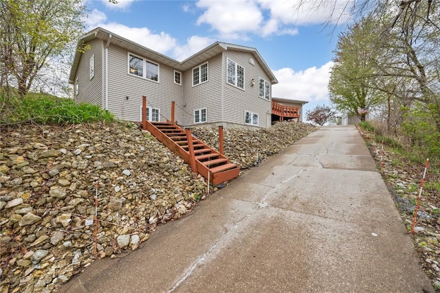 view of property exterior featuring stairway