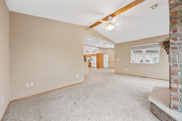unfurnished living room featuring baseboards, ceiling fan, carpet flooring, and lofted ceiling