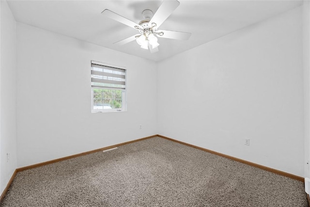 unfurnished room featuring baseboards, carpet, and visible vents