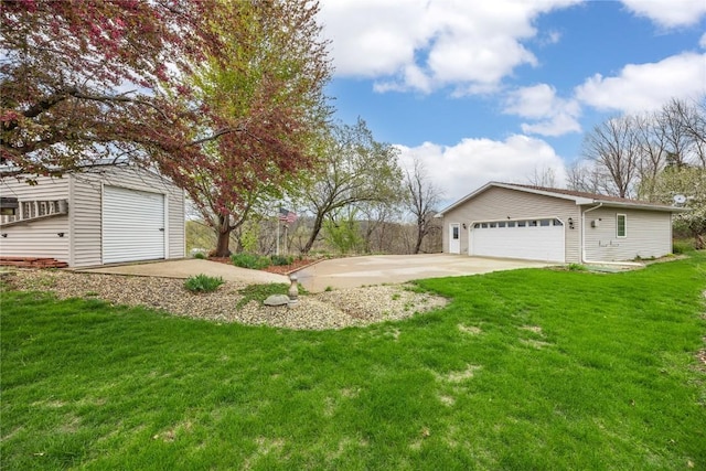 exterior space with a garage, an outdoor structure, and a front lawn