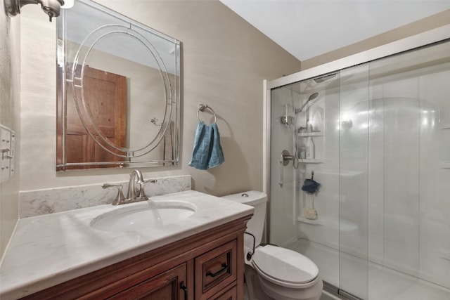 full bath featuring a shower stall, toilet, and vanity