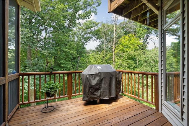 wooden terrace featuring area for grilling