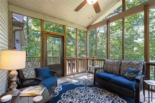 sunroom / solarium featuring wooden ceiling, ceiling fan, and vaulted ceiling