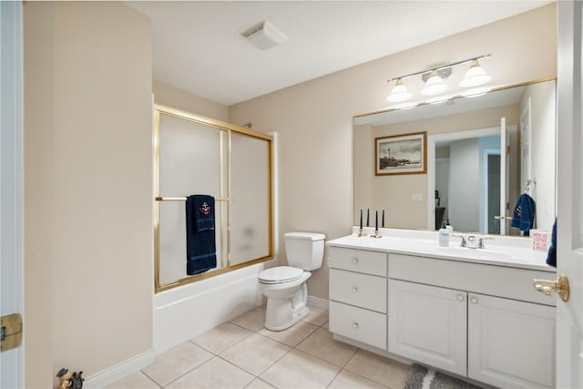 bathroom with visible vents, toilet, shower / bath combination with glass door, tile patterned floors, and vanity