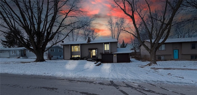 split foyer home featuring an attached garage