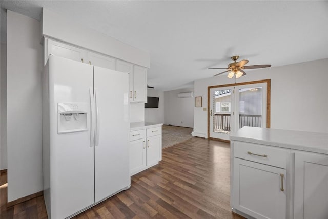 kitchen featuring white cabinetry, light countertops, dark wood finished floors, and white fridge with ice dispenser