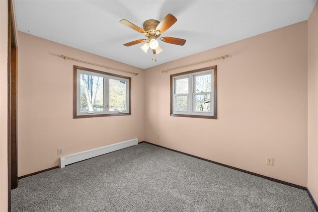 unfurnished room featuring carpet, baseboards, and baseboard heating