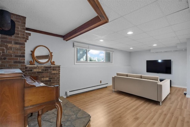 living area featuring light wood finished floors, baseboards, baseboard heating, recessed lighting, and a paneled ceiling