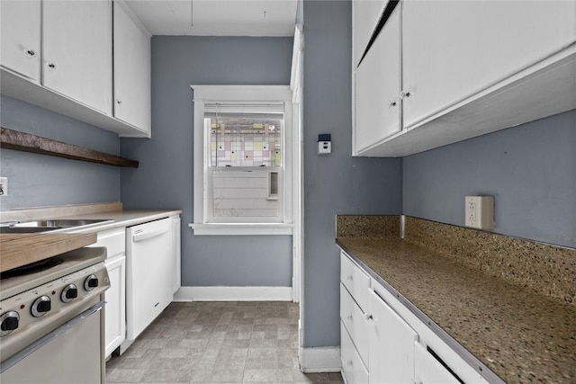 kitchen with dishwashing machine, white dishwasher, white cabinetry, baseboards, and open shelves