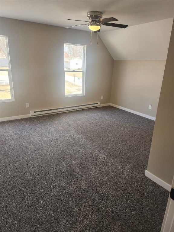 bonus room featuring a baseboard radiator, lofted ceiling, dark carpet, ceiling fan, and baseboards