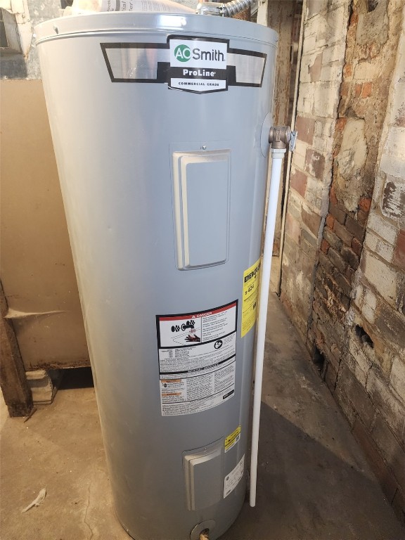 utility room with electric water heater