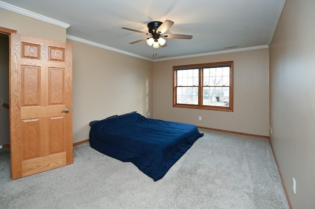 bedroom with baseboards, carpet, and crown molding