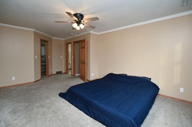 bedroom with baseboards, ceiling fan, carpet, and crown molding