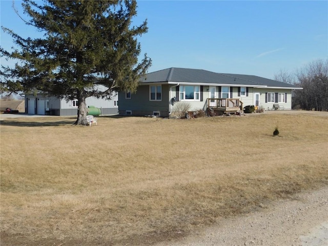 rear view of property featuring a yard