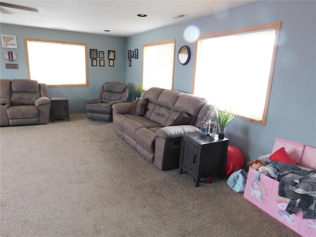 954 Monroe Ave, Tipton, IA 52772 - carpeted living area with ceiling fan