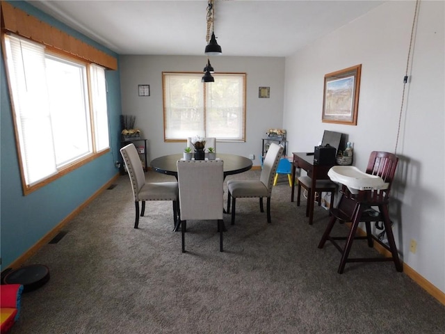954 Monroe Ave, Tipton, IA 52772 - dining room featuring healthy amount of natural light, carpet floors, and baseboards