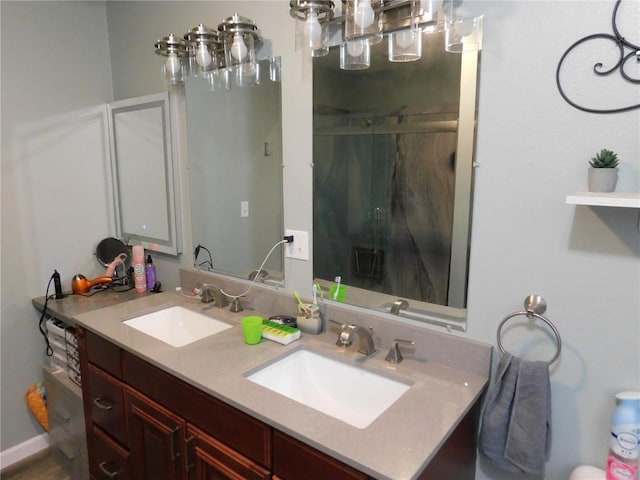 954 Monroe Ave, Tipton, IA 52772 - bathroom with a stall shower and double vanity