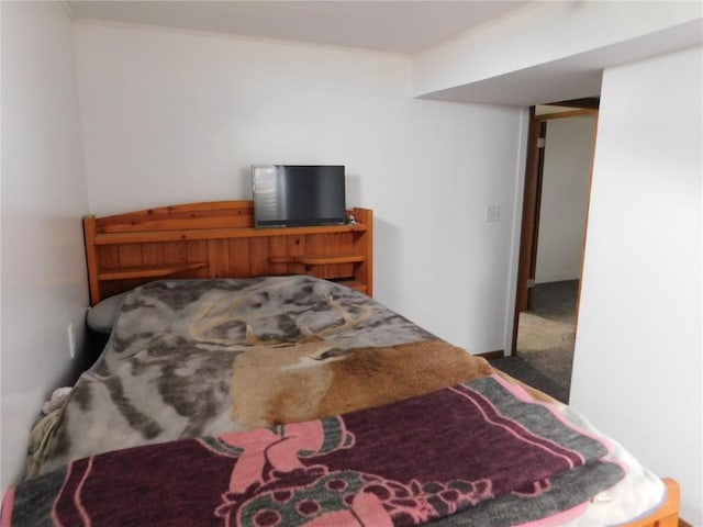 954 Monroe Ave, Tipton, IA 52772 - bedroom with carpet floors and crown molding