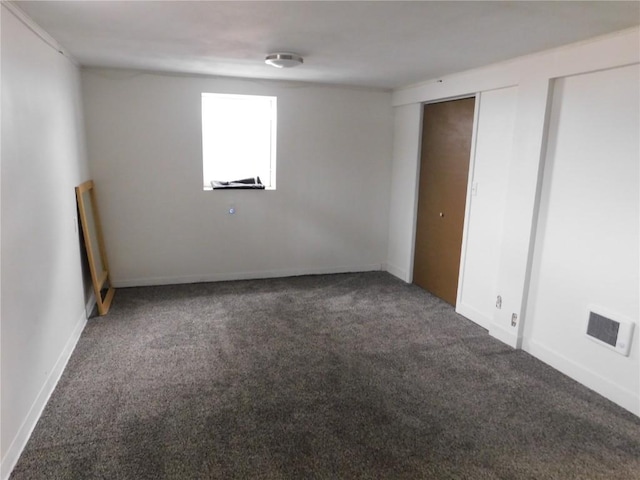 954 Monroe Ave, Tipton, IA 52772 - unfurnished bedroom featuring carpet and baseboards