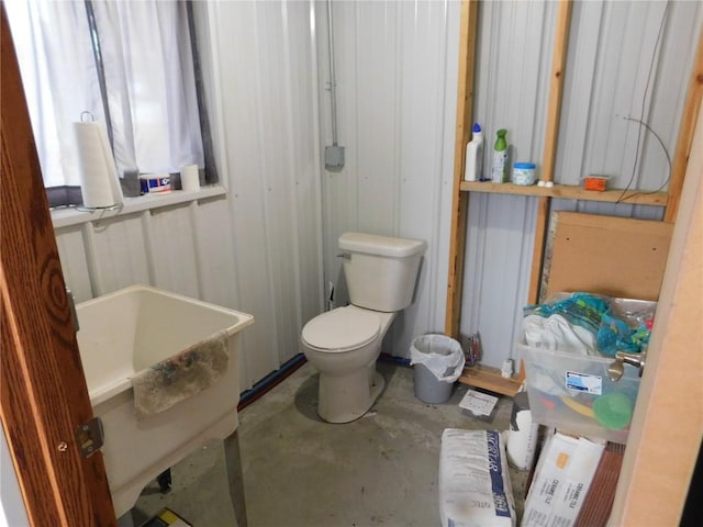 954 Monroe Ave, Tipton, IA 52772 - bathroom featuring unfinished concrete floors and toilet