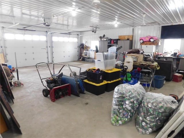 954 Monroe Ave, Tipton, IA 52772 - garage featuring a garage door opener