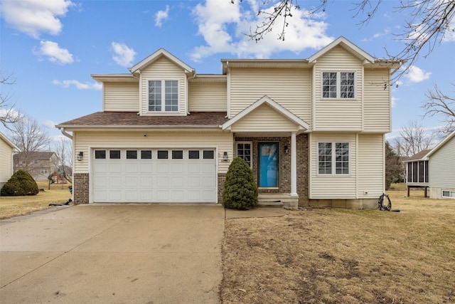 view of front facade featuring a garage, driveway, brick siding, and a front lawn