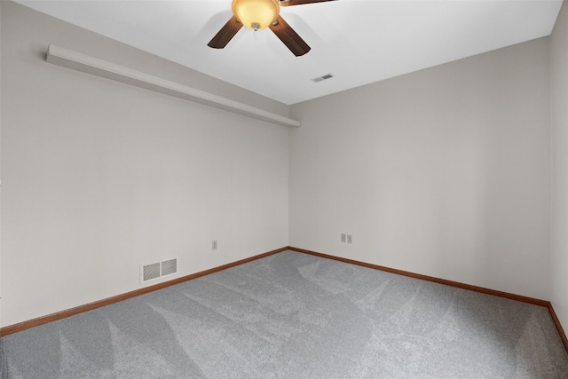 unfurnished room with baseboards, ceiling fan, visible vents, and carpet flooring