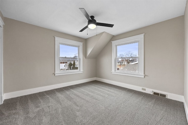 bonus room with visible vents, baseboards, a ceiling fan, lofted ceiling, and carpet