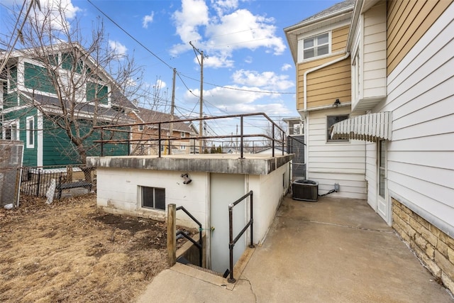 view of patio / terrace with fence and central AC