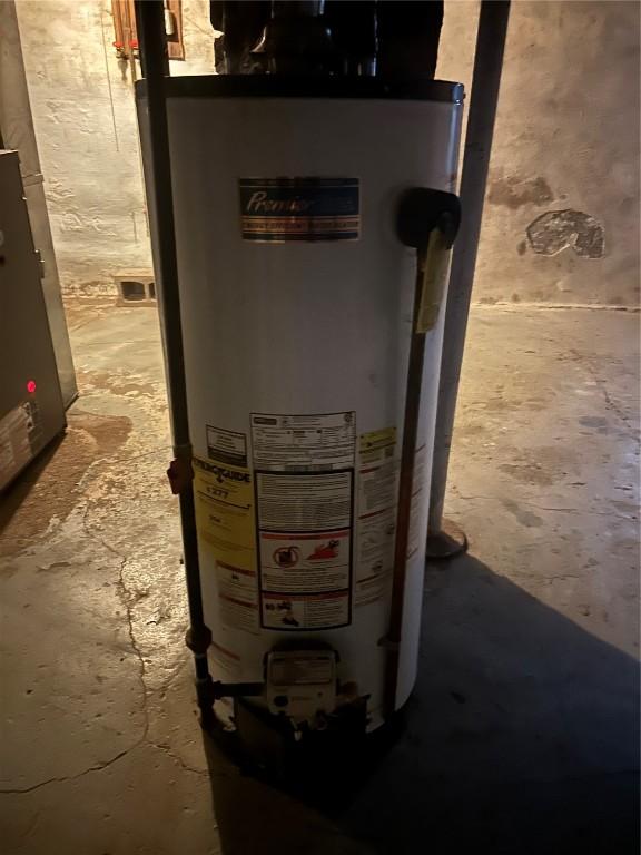 utility room featuring gas water heater