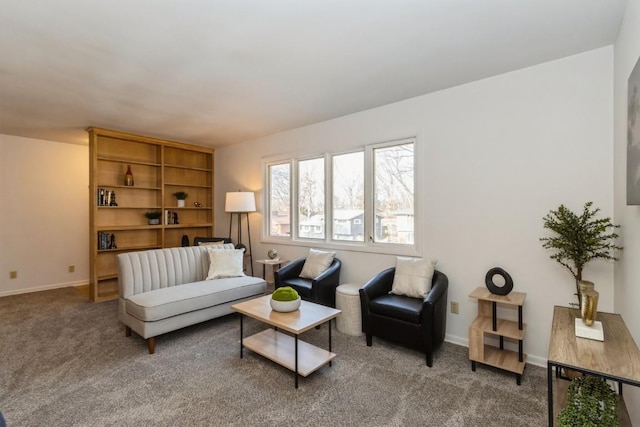 living room featuring carpet floors and baseboards