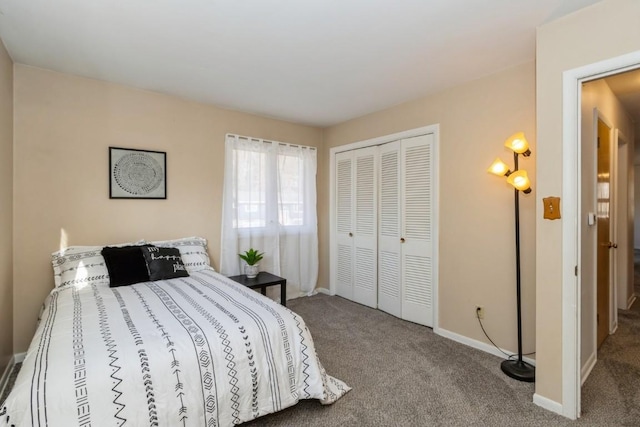 bedroom with a closet, carpet, and baseboards