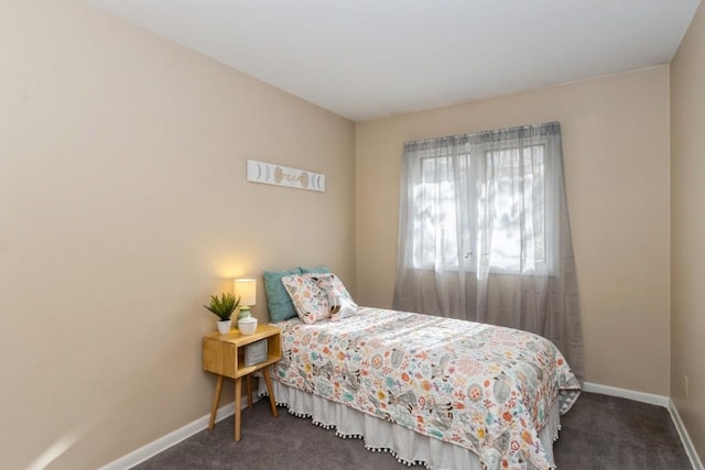 carpeted bedroom with baseboards