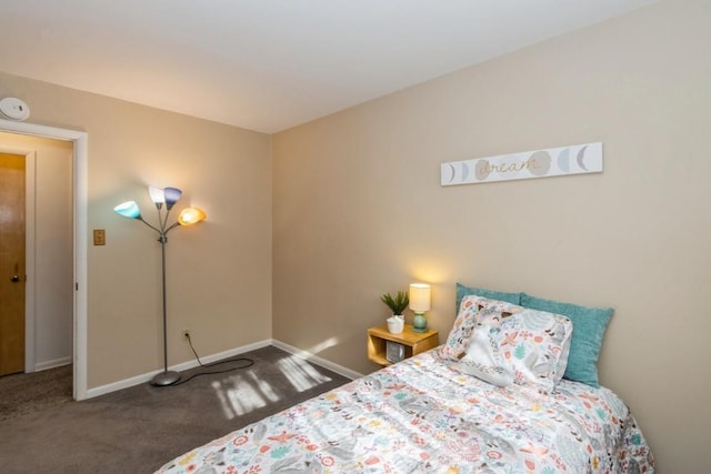 carpeted bedroom featuring baseboards