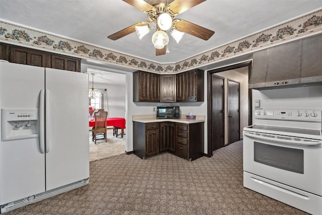 kitchen featuring dark brown cabinetry, white appliances, a ceiling fan, light countertops, and built in desk