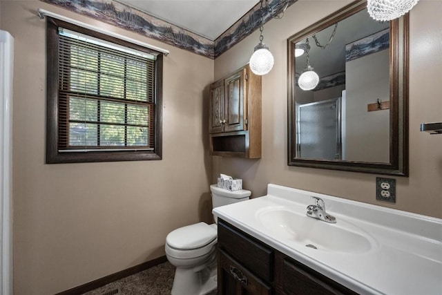 full bath featuring toilet, baseboards, an enclosed shower, and vanity