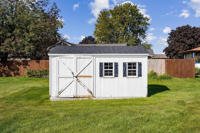 view of shed with fence