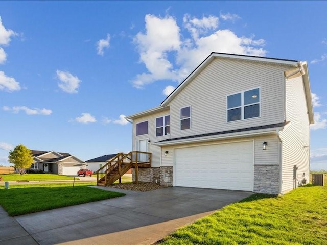 view of front of property featuring an attached garage, stone siding, driveway, and a front lawn