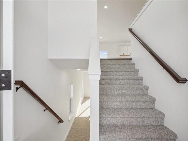 stairs with carpet flooring