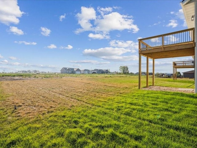 view of yard with a wooden deck