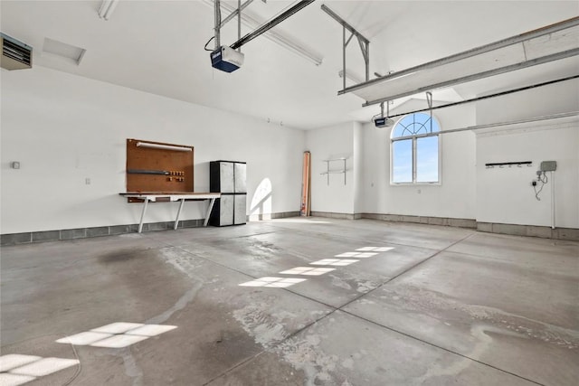 garage featuring visible vents and a garage door opener