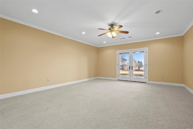 spare room with french doors, crown molding, recessed lighting, light carpet, and baseboards