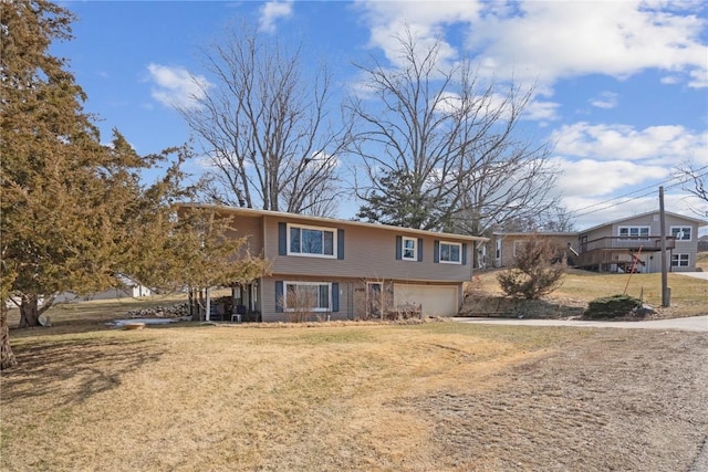 view of front of home featuring a front yard and an attached garage