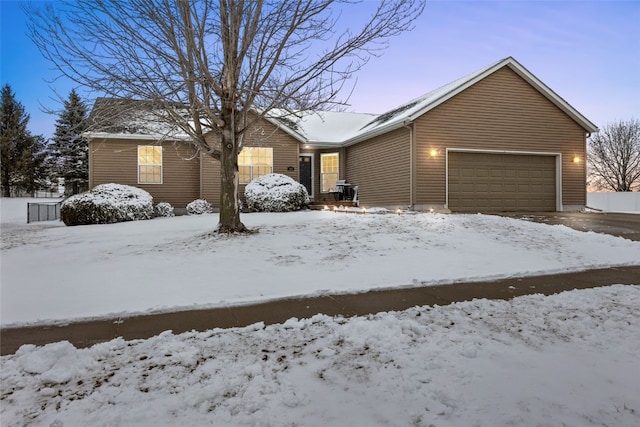 ranch-style house featuring an attached garage