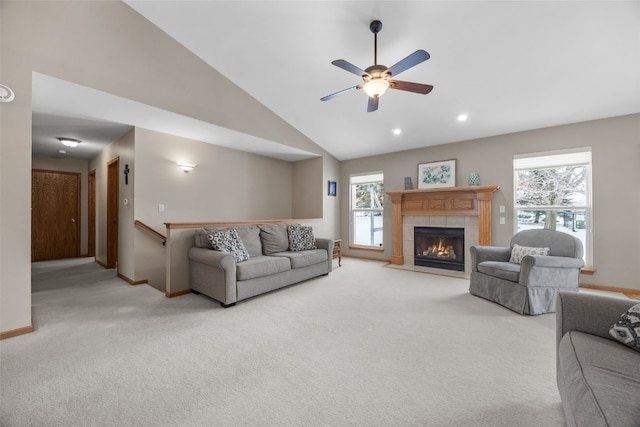 living room with carpet, a fireplace, and baseboards