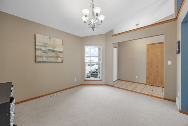 empty room with visible vents, baseboards, carpet, vaulted ceiling, and a chandelier